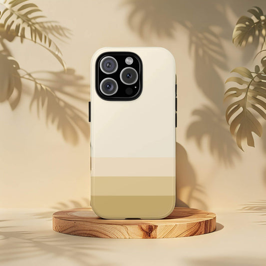 Minimalist Paris iPhone 16 Pro tough phone case with a four tone design on a wooden stand with leaf shadows