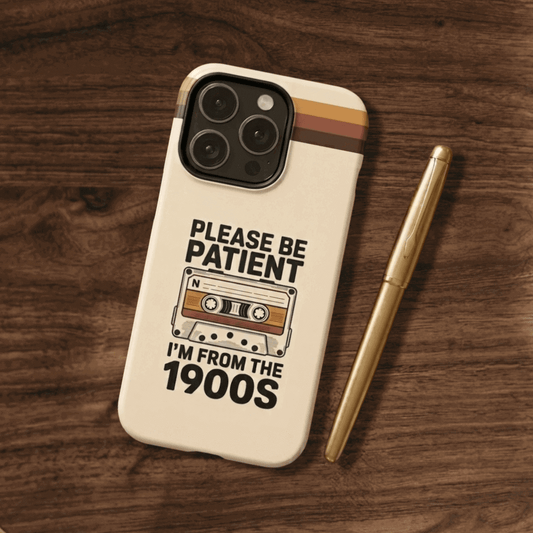 Tough phone case with a vintage cassette tape design on a wooden surface 