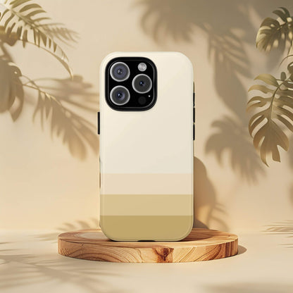 Minimalist Paris iPhone 16 Pro tough phone case with a four tone design on a wooden stand with leaf shadows