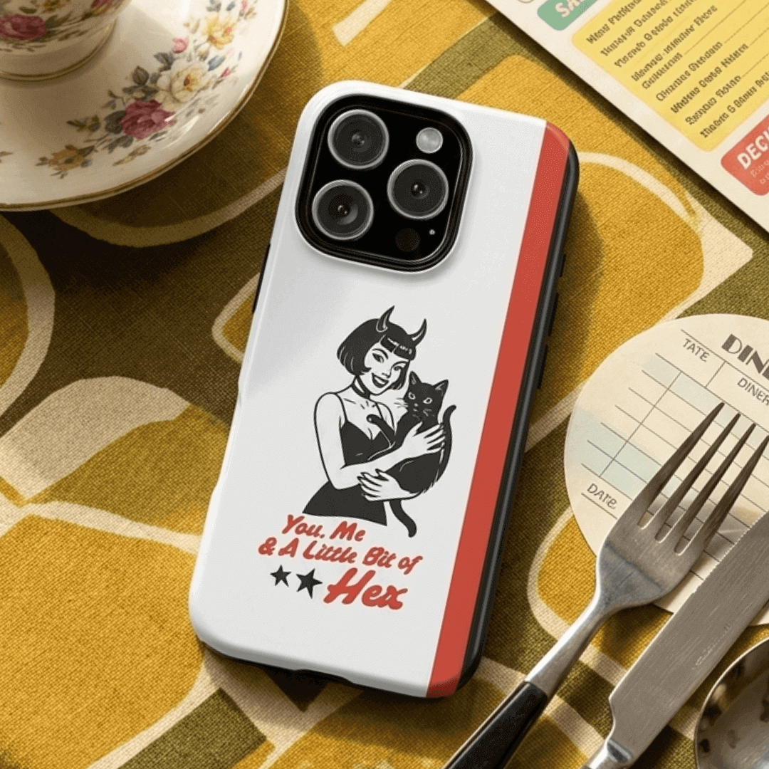 Tough phone case with a design of a woman holding a cat in black on a dining table