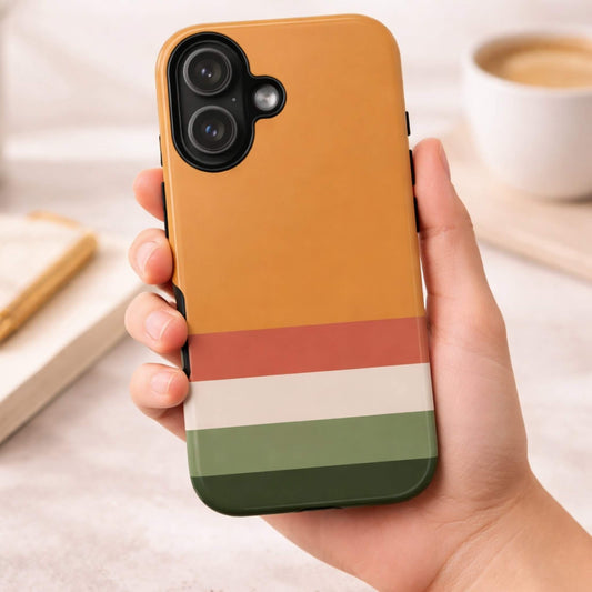 Hand holding a autumn tone color tough phone case