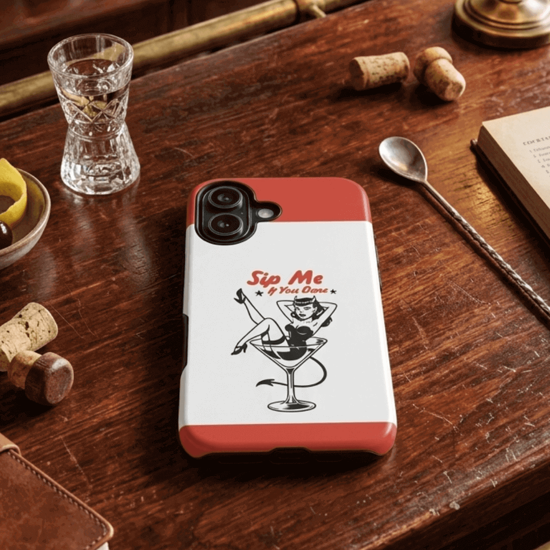 Tough phone case with a cocktail themed design on a wooden table with bar accessories