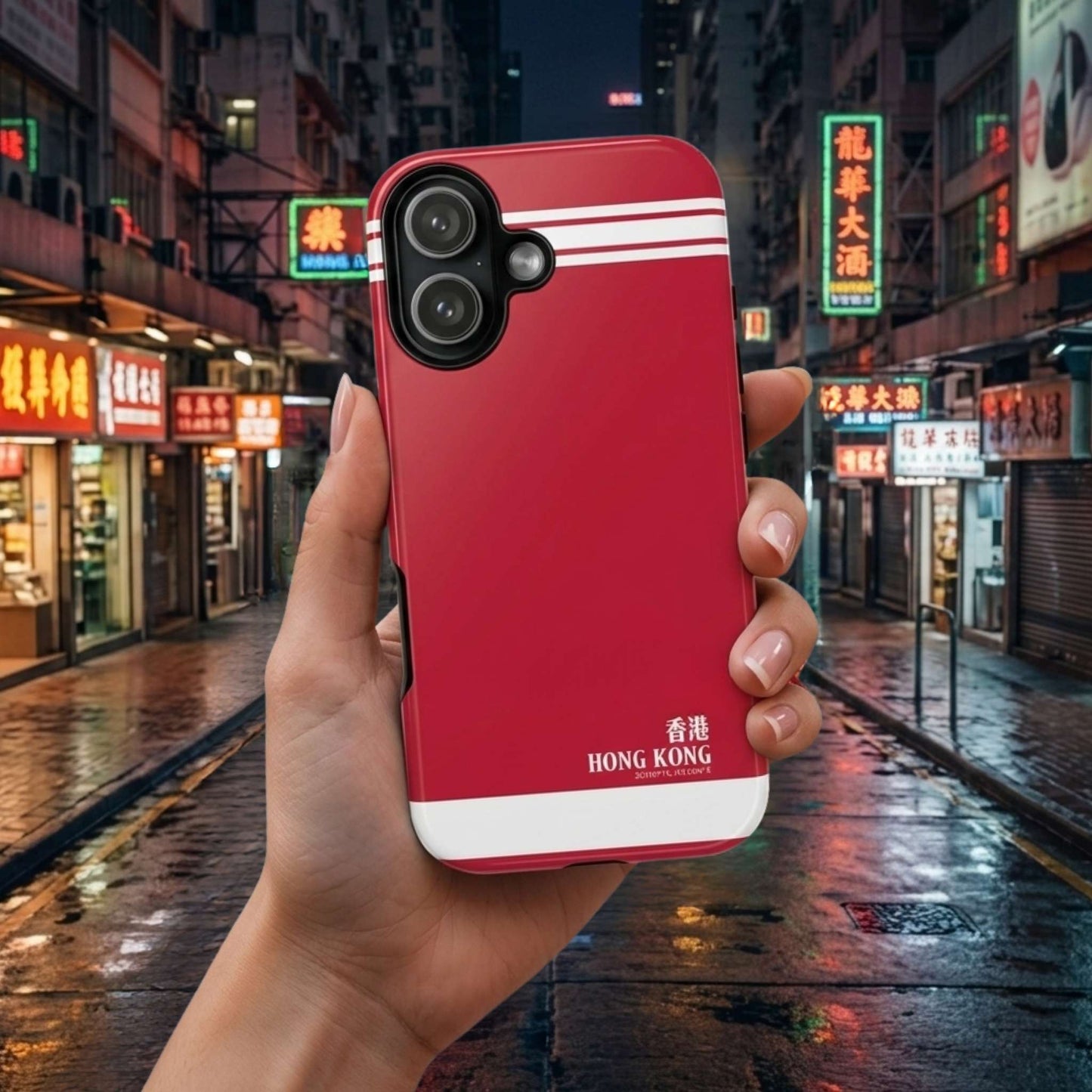 iPhone 17 red phone case with Hong Kong text held in front of a city street at night