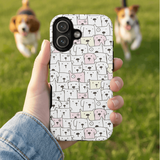 Tough phone case with dog pattern held by a person with dogs running in the background